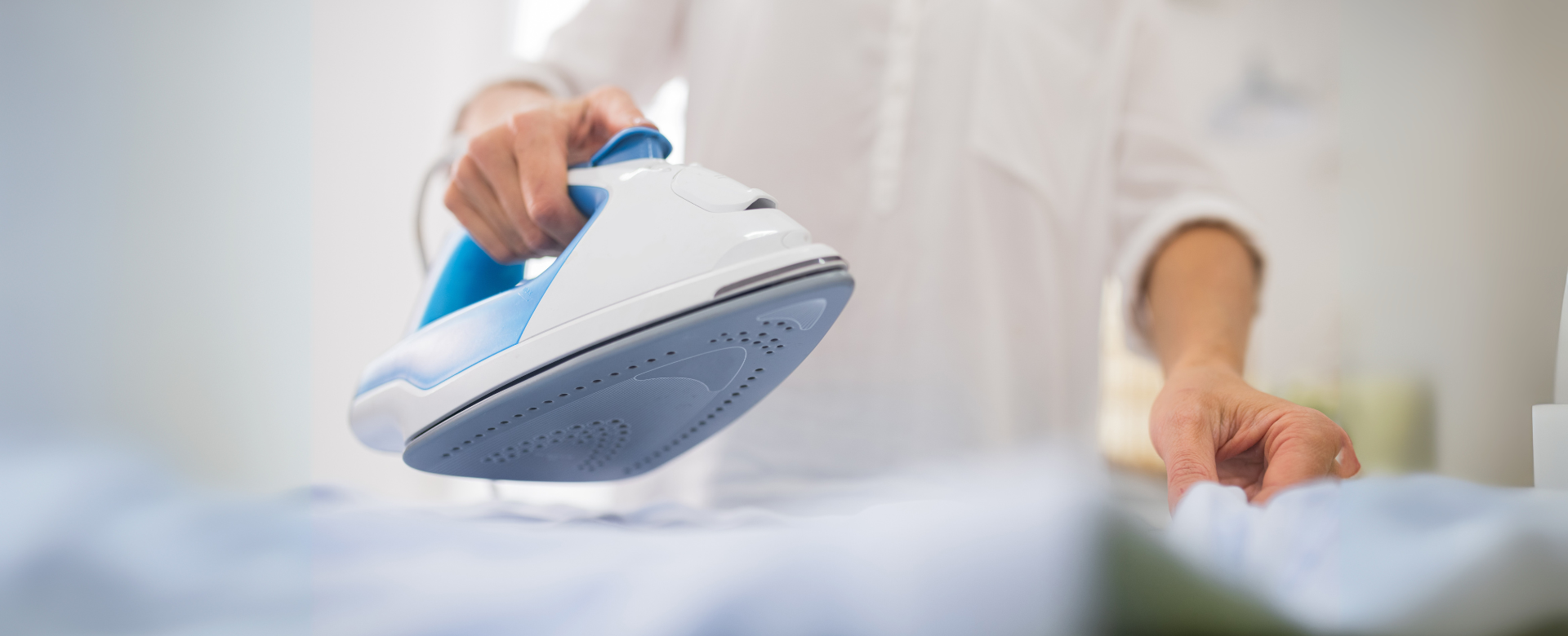 Step-by-step ironing service process showing pickup, professional pressing, and delivery in BC